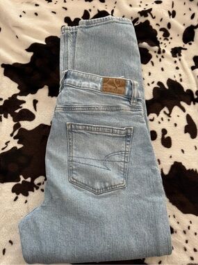 American Eagle Outfitters Light Blue Denim Jeans with Brown Leather Patch